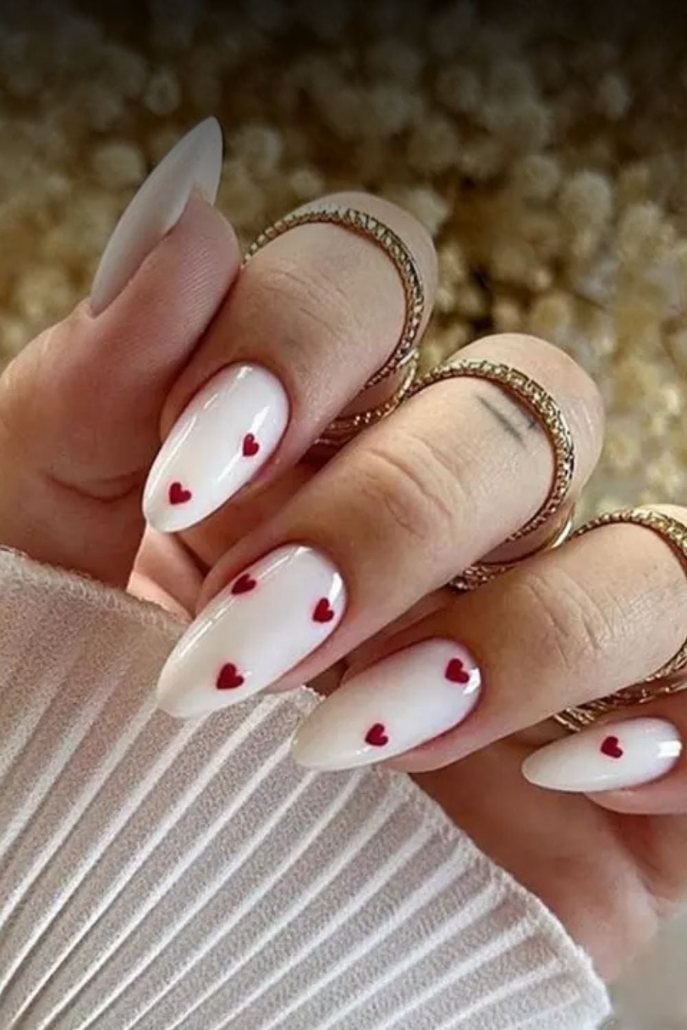 Almond shaped milky white nails with a glossy finish for a romantic evening event.
