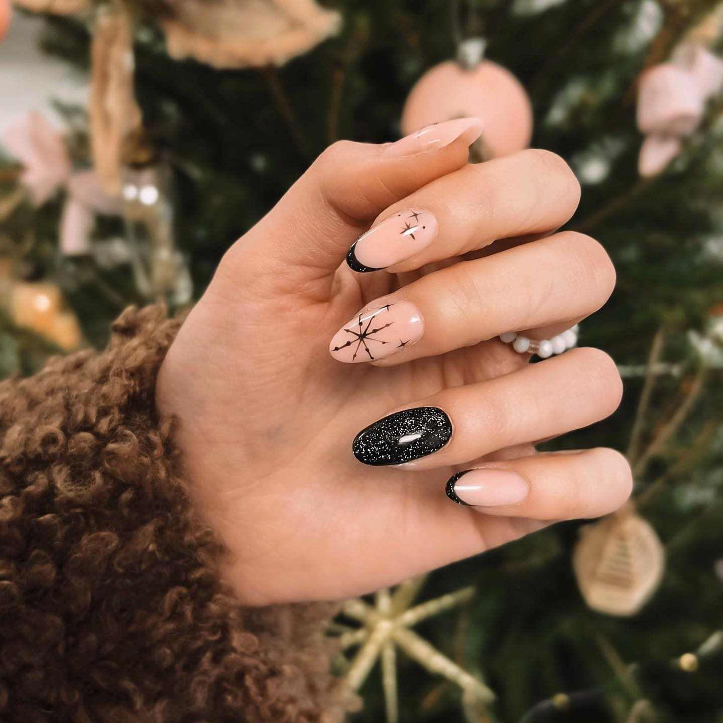 Black Nude Star Almond Nails