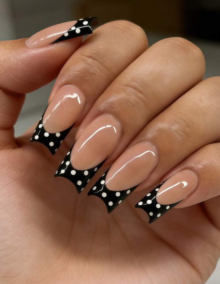 Elegant black polka dot french tip nails on long coffin glossy finish for formal dinners.