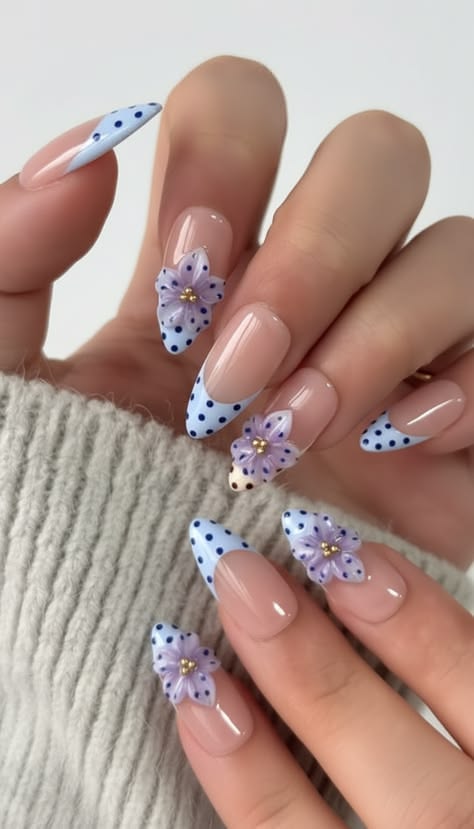 Powder blue bow french tip nails on oval shiny gel polish ideal for spring weddings.