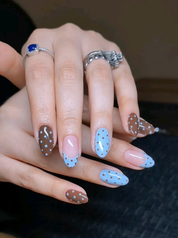 Royal blue floral french tip nails on oval glossy base for afternoon tea parties.
