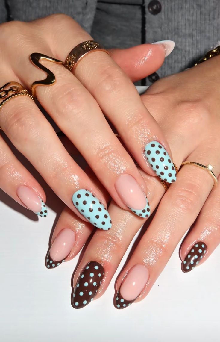 Baby blue polka dot french tips on short square shiny polish for casual everyday wear.