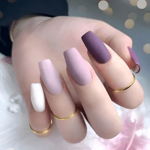 Romantic bridal nail designs 2025 - elegant lavender and white French tips with soft glitter and romantic heart accents for dreamy wedding nails