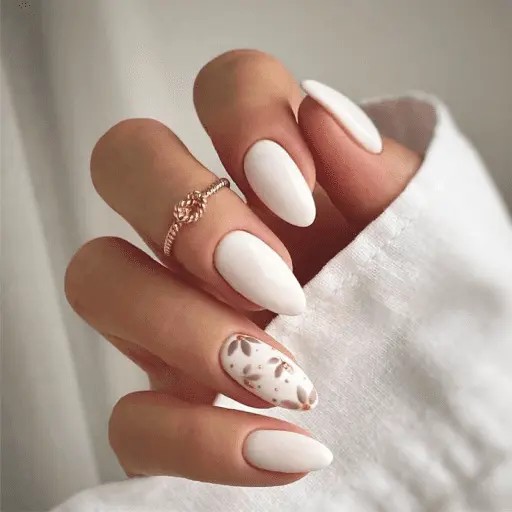 Romantic bridal nail designs 2025 - soft dusty rose base with elegant white floral designs and pearl accents for sophisticated romantic wedding nails