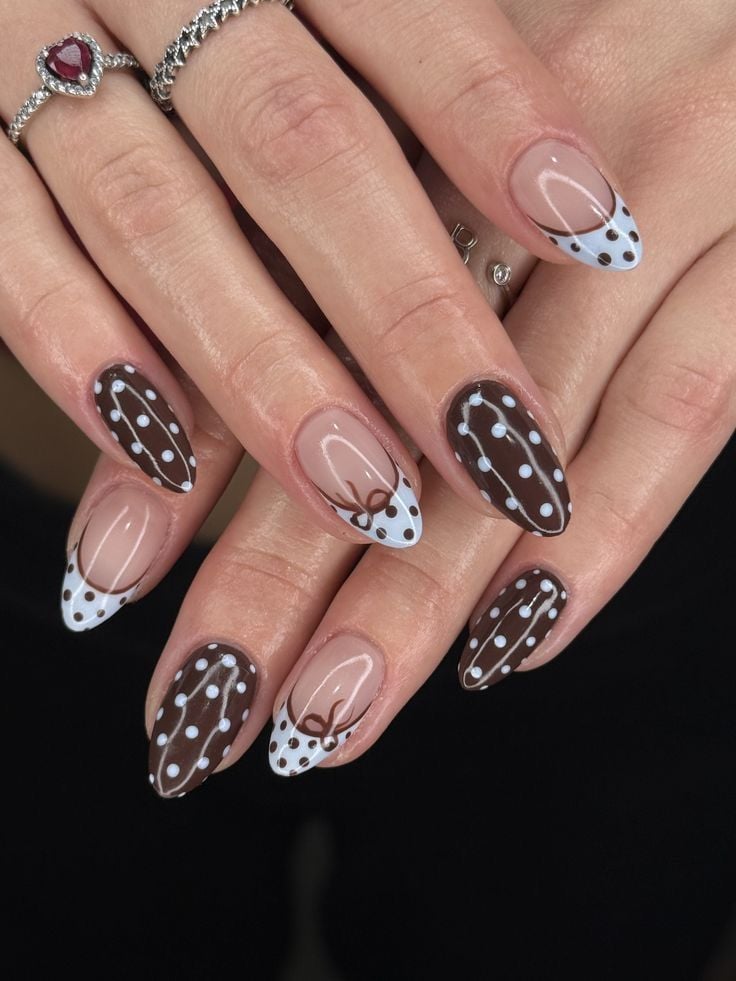 Chocolate brown polka dot french tip nails on almond glossy gel for autumn fashion.