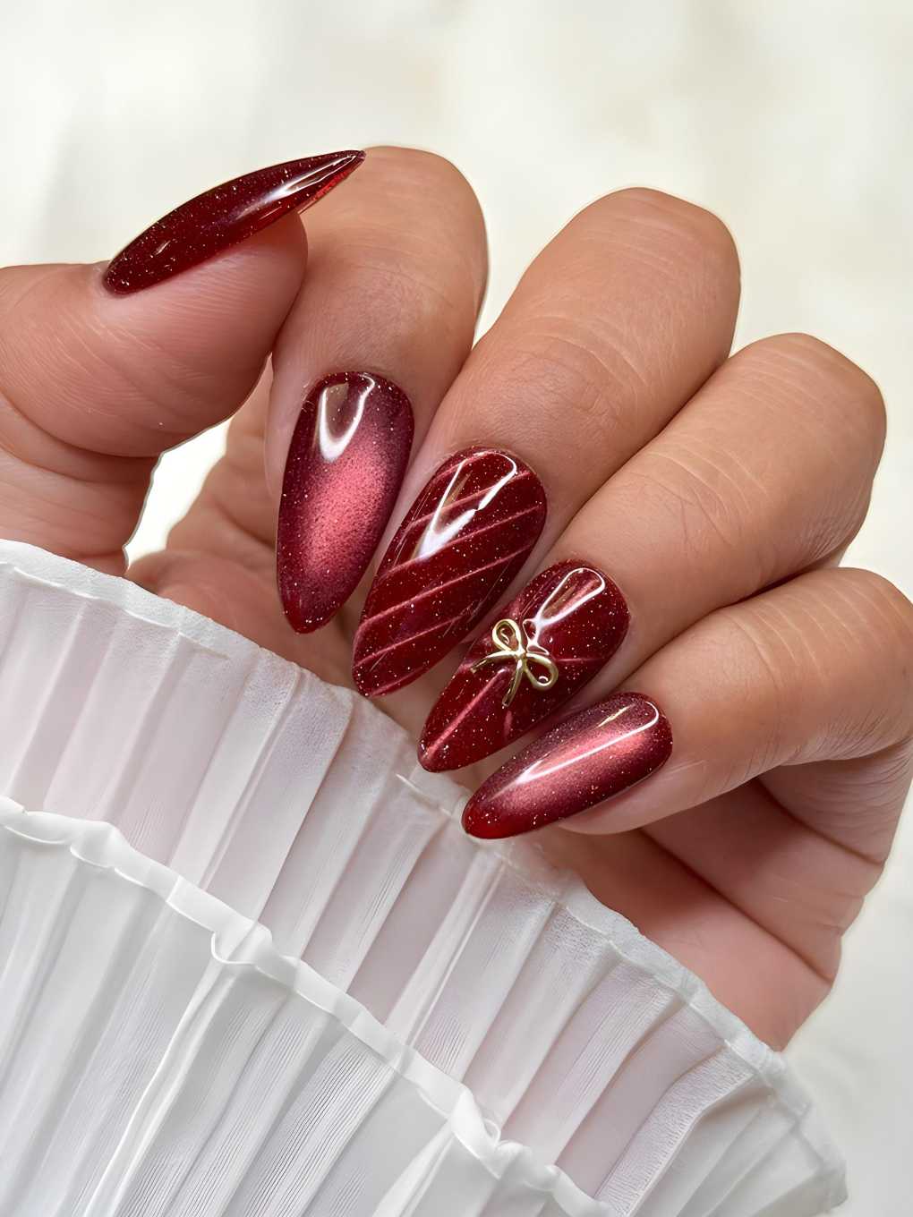 Burgundy Cat Eye Magnetic Nails With Gold Bow Charm