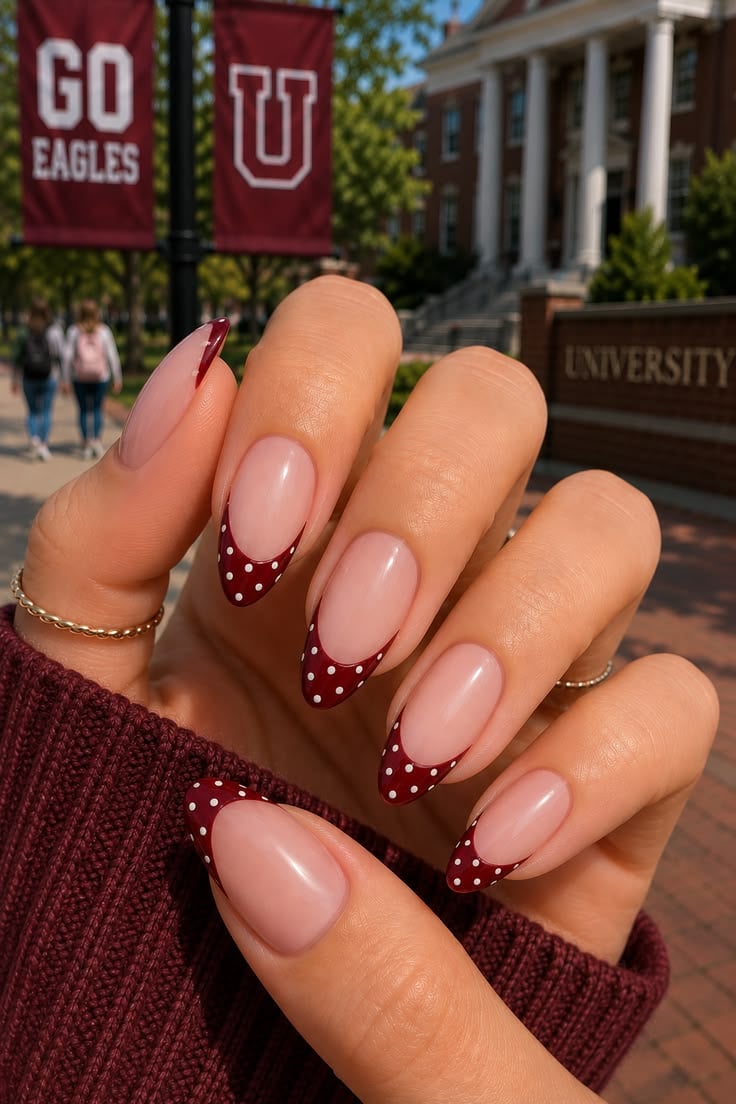 Deep burgundy red dot french tip nails on coffin glossy finish for evening date night.