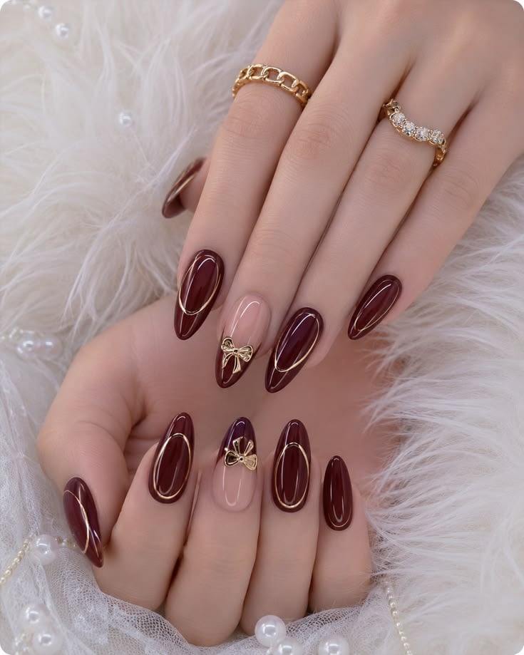 Burgundy Nails With Gold Outline