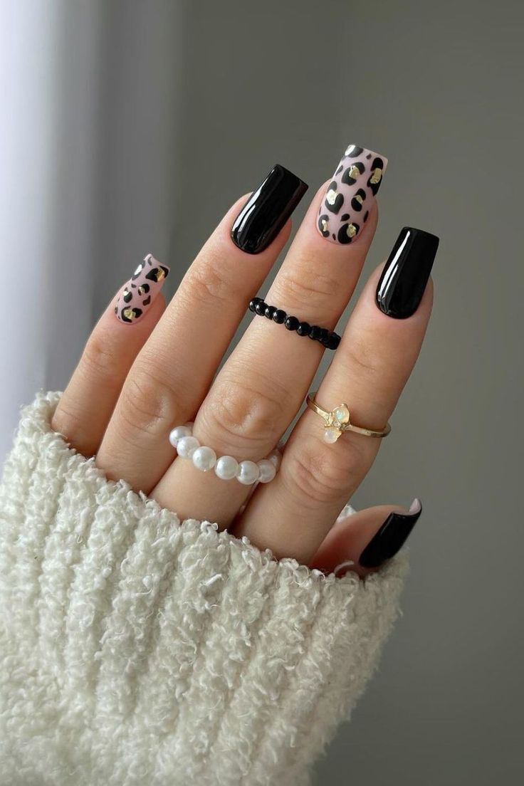 Chic Black Nails With Leopard Print Accent