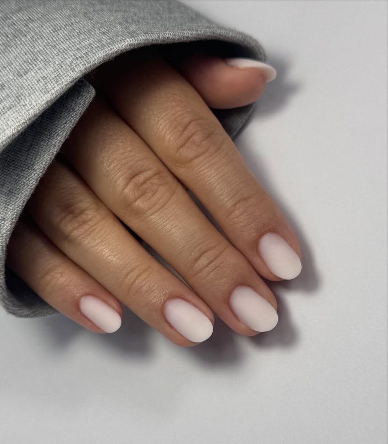 Short oval shaped matte milky white nails with a cloud-like finish for casual outings.