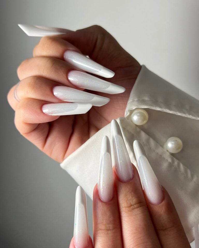 Coffin shaped semi-sheer milky white nails with a high-shine finish for formal events.