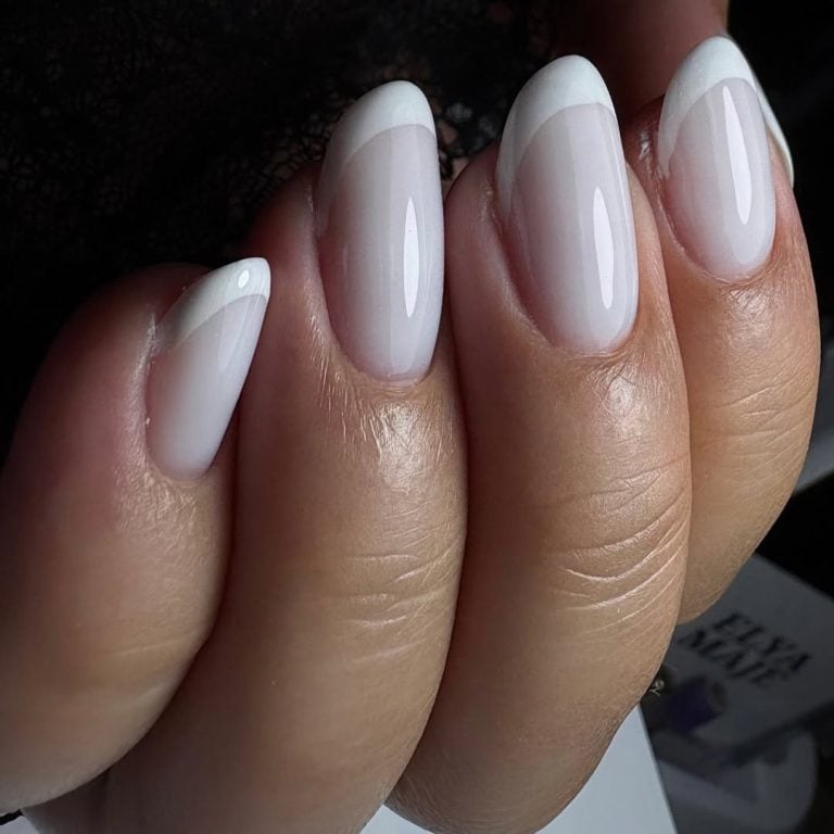 Square shaped sheer milky nails with a modern contour French tip for corporate wear.