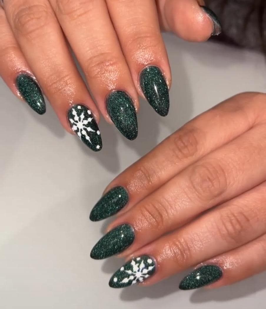 Dark Green Sparkle Almond Nails With White Snowflake Art