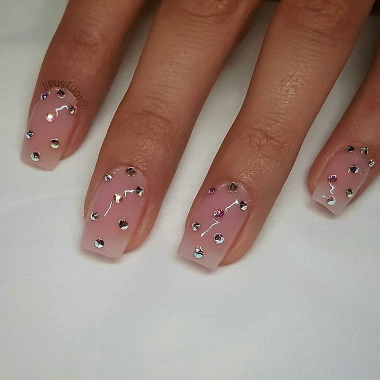 Long almond neutral blush elegant rhinestone nails with ultra gloss finish for formal events.