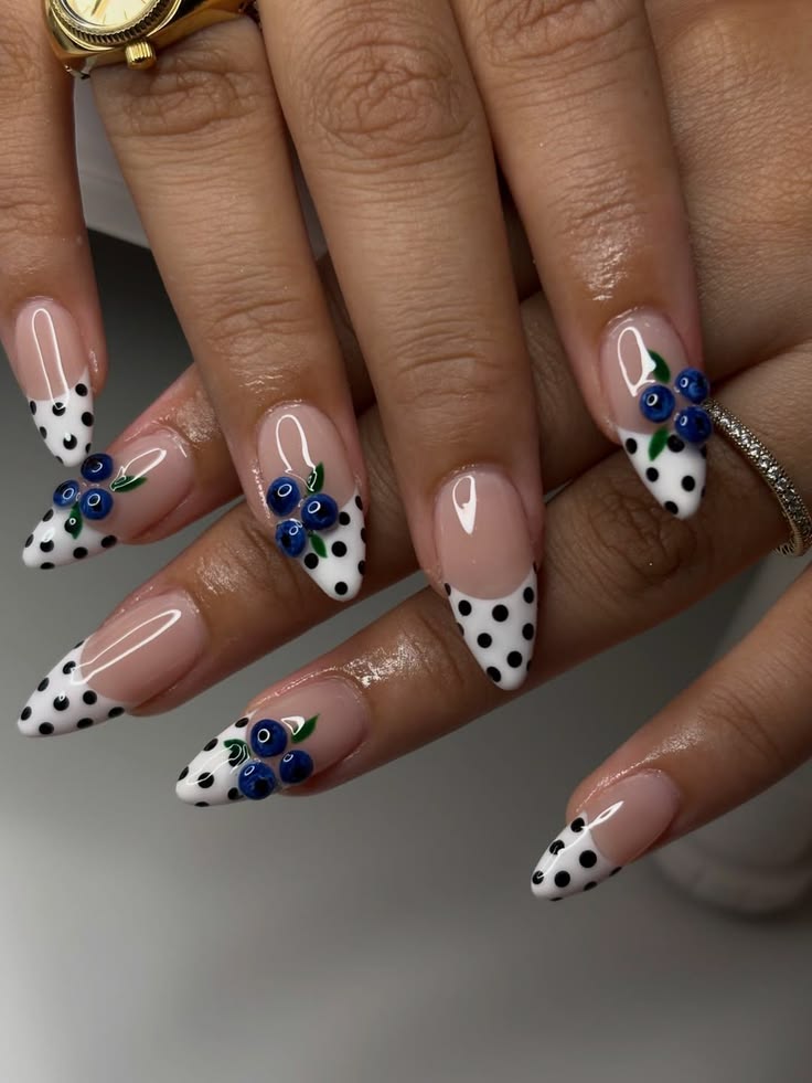 Pastel floral dot french tip nails on almond glossy polish for spring aesthetic.