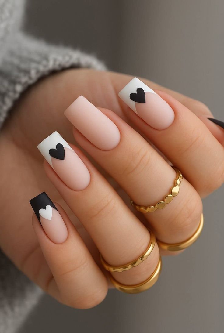 Classic French tip nails with elegant white tips on natural pink base showcasing sophisticated almond-shaped nails with perfect smile lines