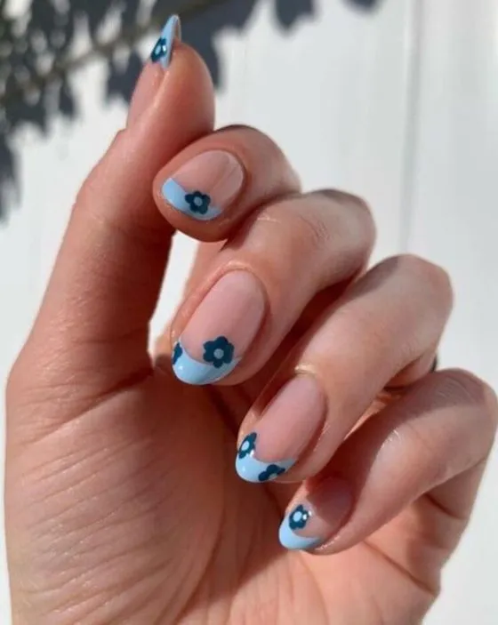 Elegant French tip nails with gold glitter accent line beneath white tips for luxurious sparkle
