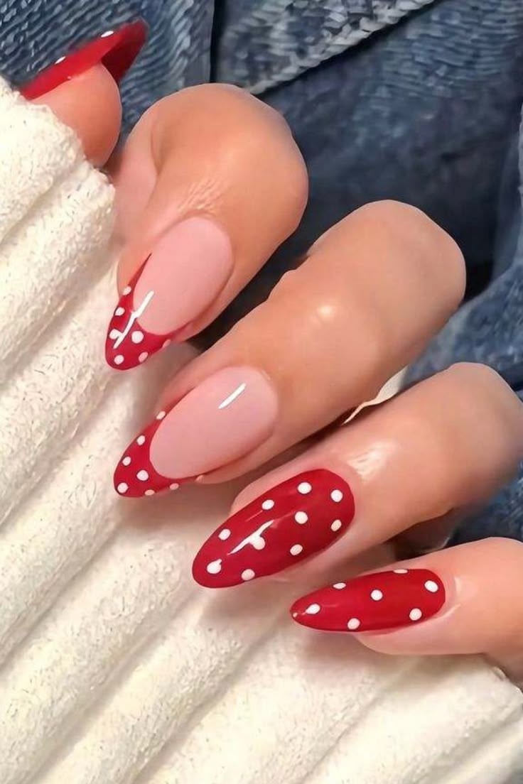 Chic black and white polka dot french tip nails on coffin glossy gel polish.