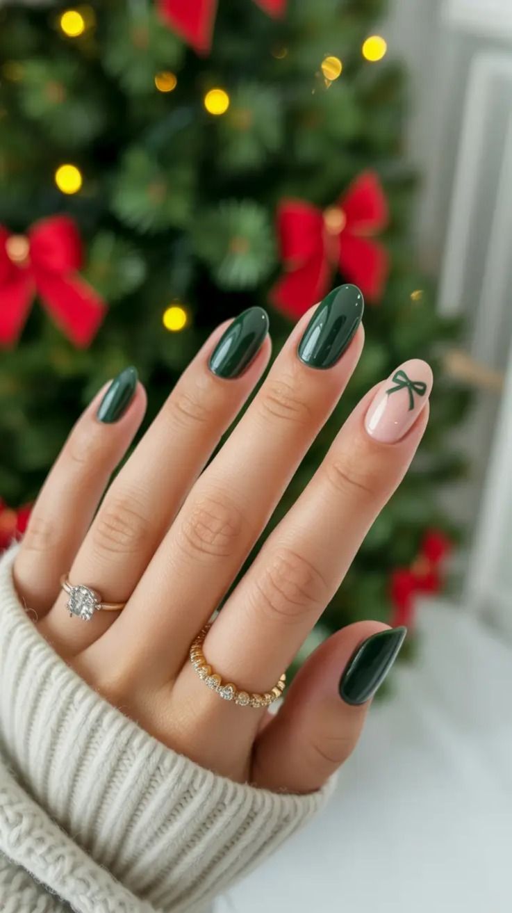 Glossy Emerald Green Oval Nails With Dainty Bow Accent