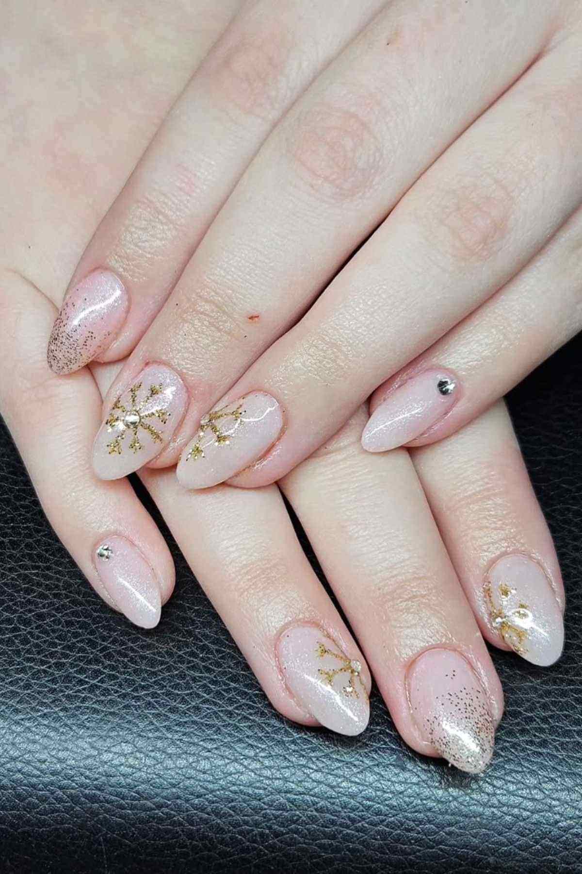 Gold Snowflake Almond Nails