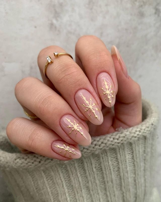 Gold Snowflake Nude Almond Nails