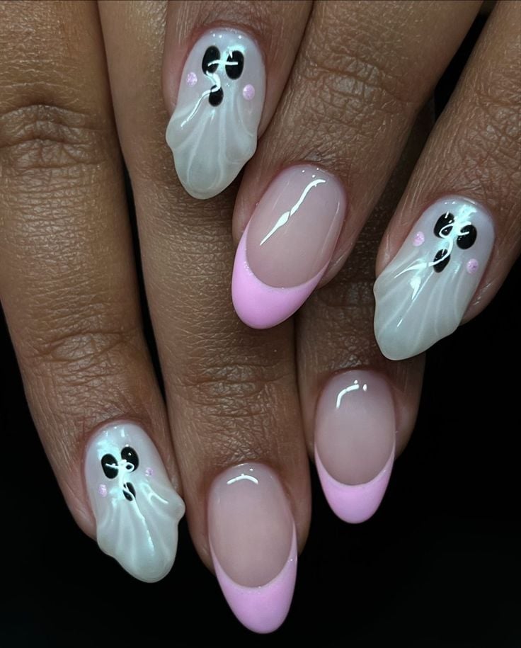 Squoval glossy orange and black abstract Halloween art nails for festive October styling.