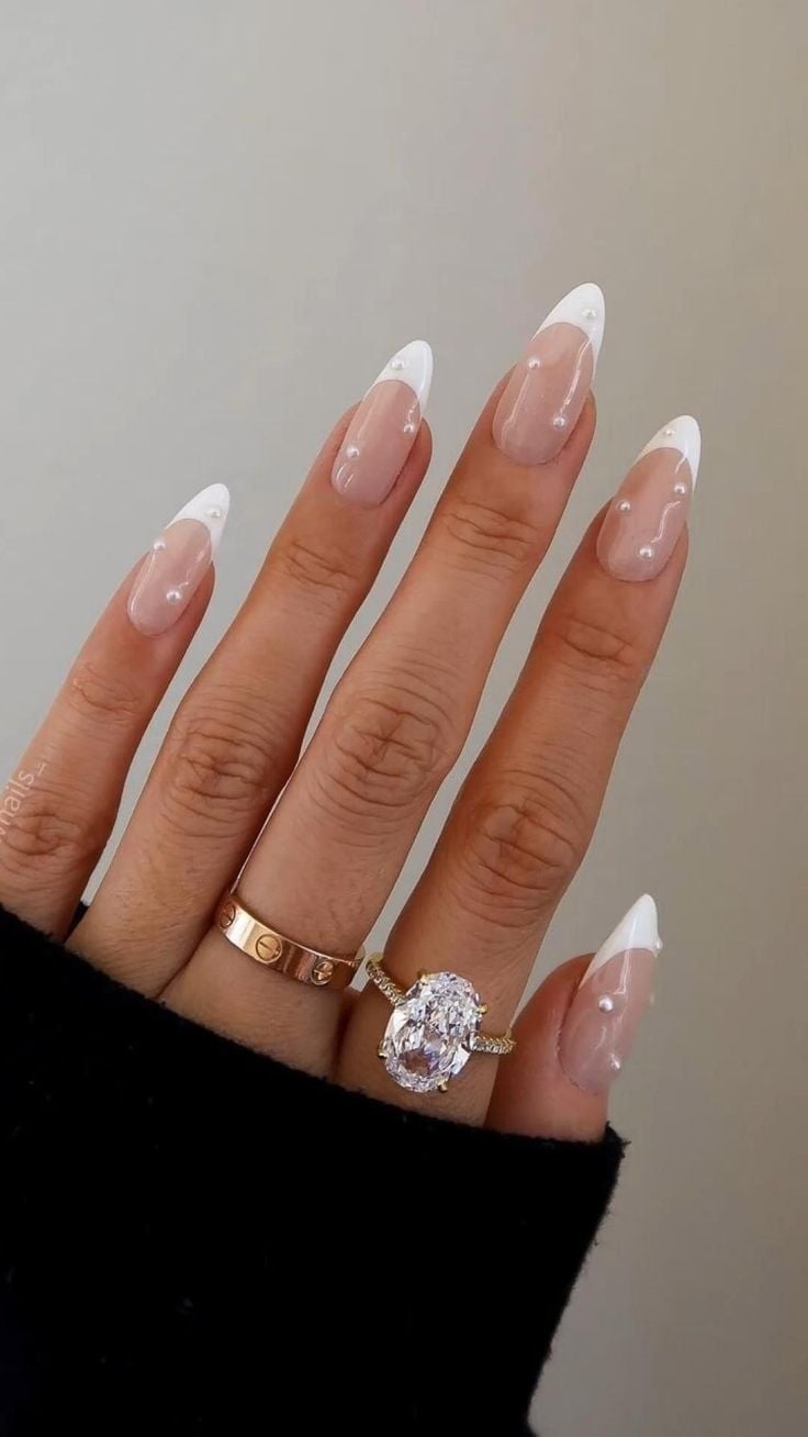 Short oval sheer nude minimal pearl rhinestone nails with natural gloss finish for daily wear.