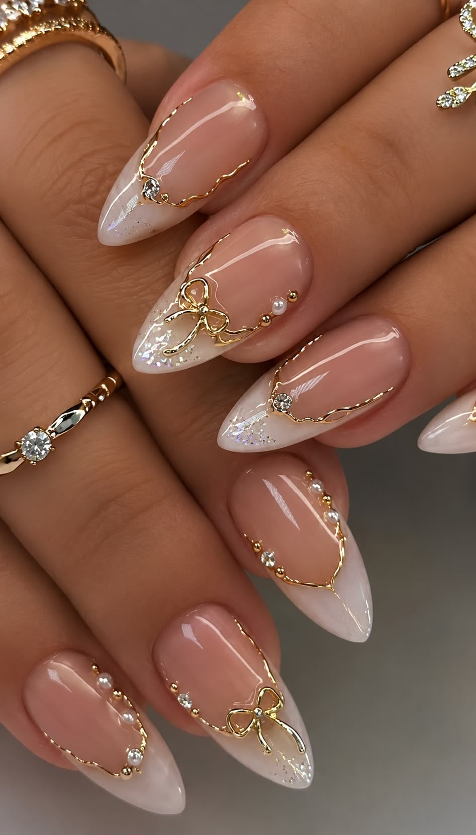 Medium coffin nude gold foil rhinestone nails with high gloss finish for autumn galas.