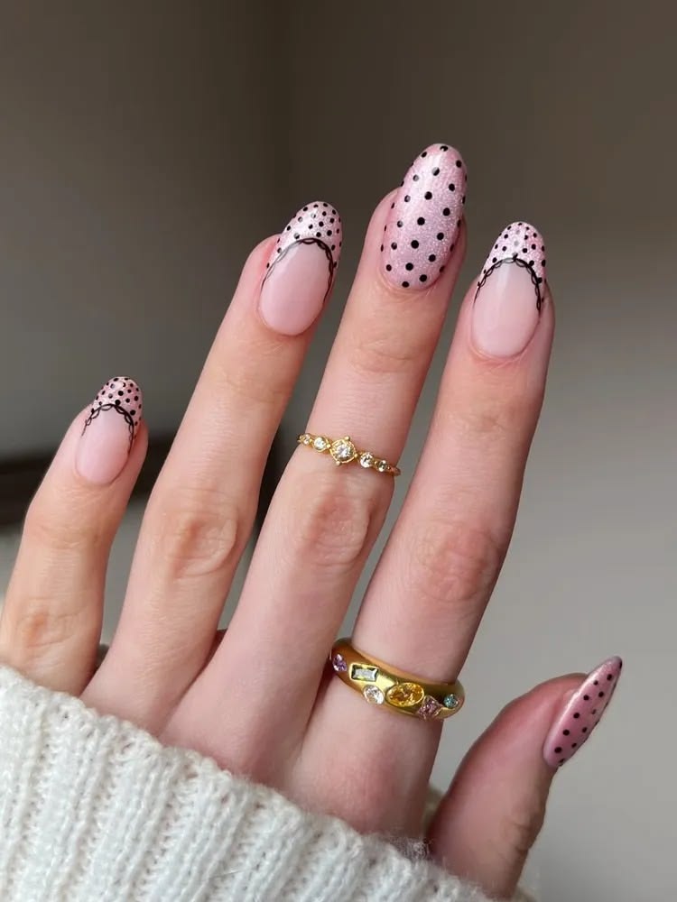 Bubblegum pink dot french tip nails on oval glossy base for playful coquette aesthetics.