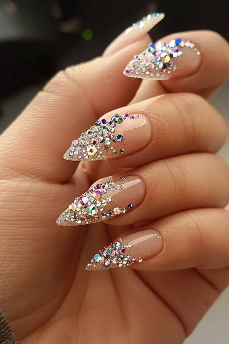 Long stiletto pink pearl glam rhinestone nails with shiny gel finish for red carpet events.
