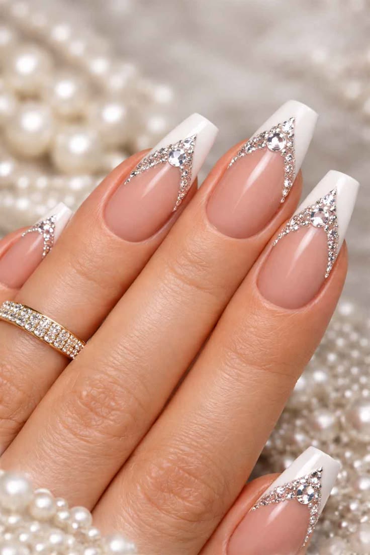 Long almond nude crystal outline french rhinestone nails with glossy finish for parties.