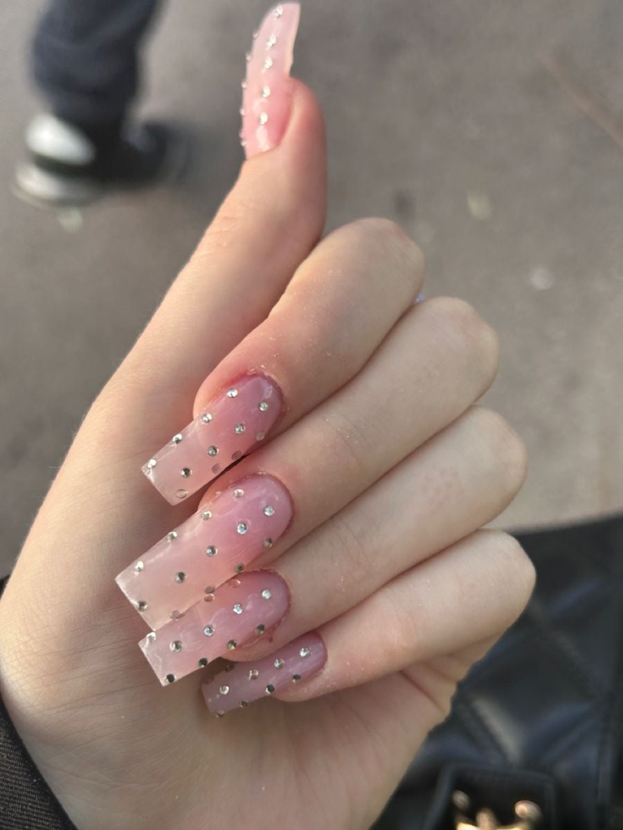Long coffin statement multi-cut rhinestone nails with high gloss shine for gala dinners.