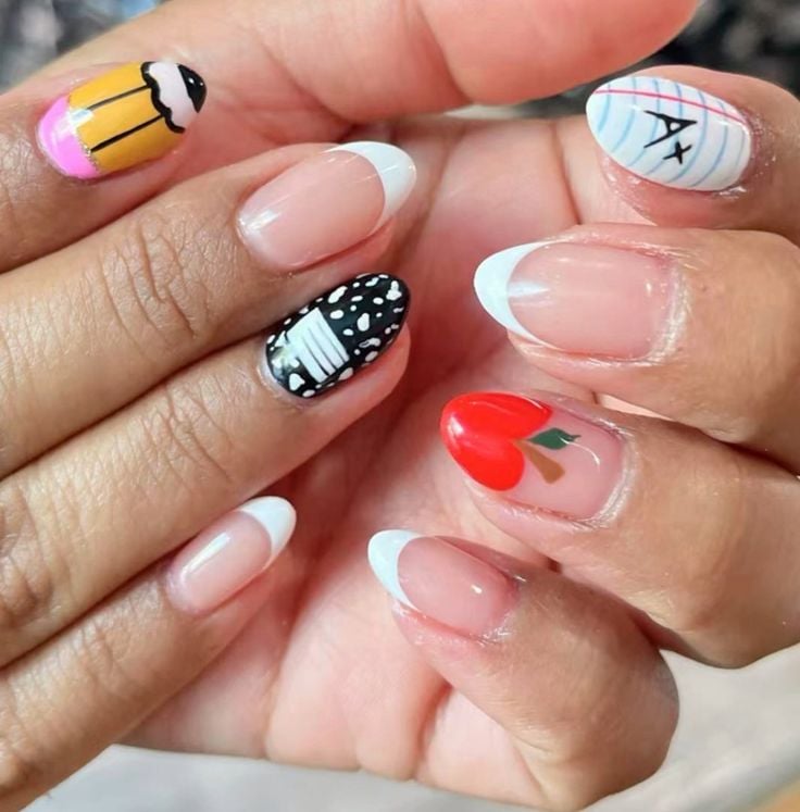 Short round sheer pink nails with gold chrome star stickers and shiny top coat.