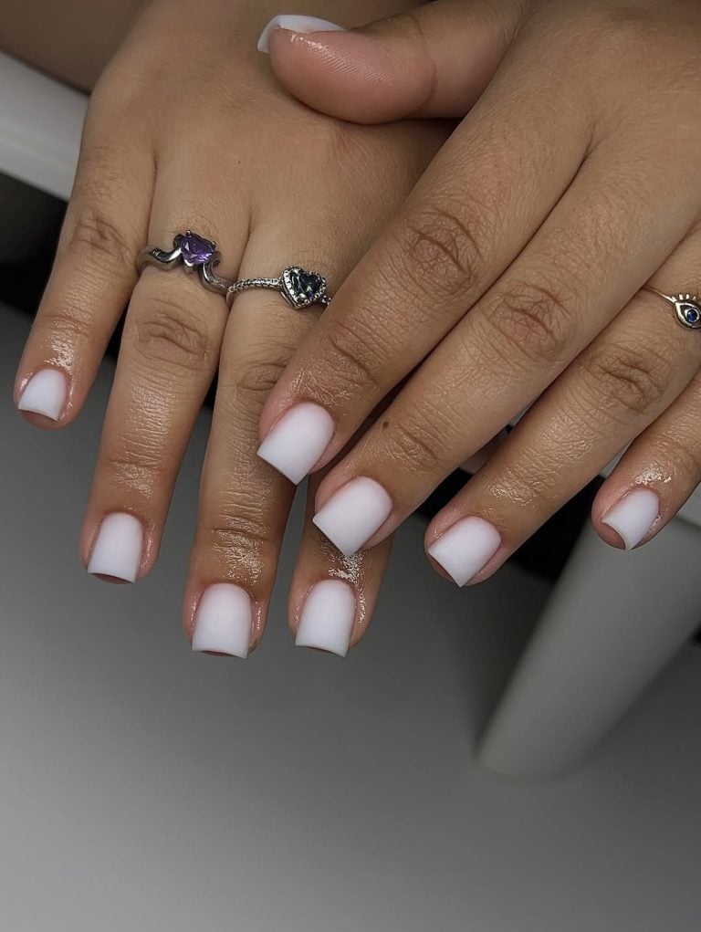 Short active round shaped soft milky white gel nails for daily yoga sessions.