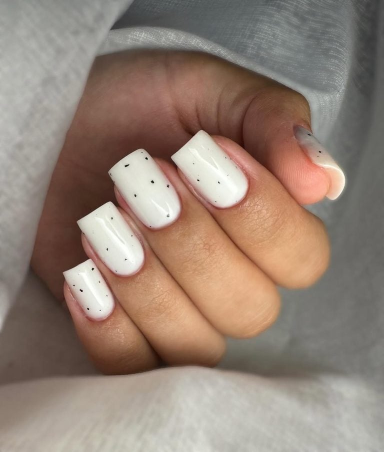 Short square shaped milky white nails with micro-glitter sprinkles for birthday parties.