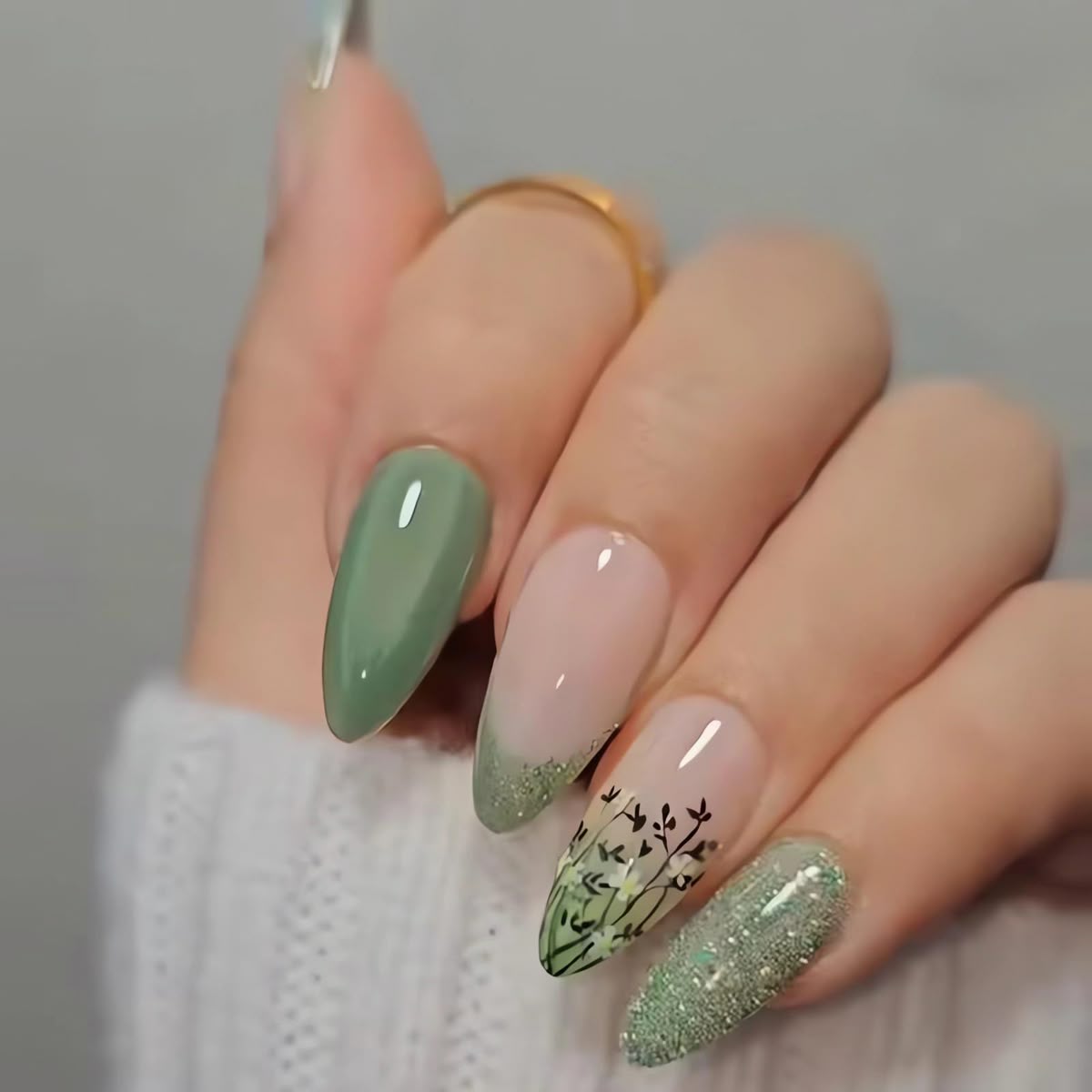 Summer nails 2025 - elegant sage green and nude nail art with botanical leaf designs and glitter French tips for sophisticated spring manicures