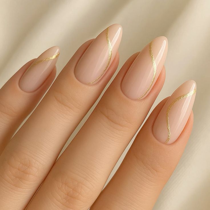 Summer nails 2025 - elegant nude nail art with delicate gold metallic line accents for sophisticated minimalist summer manicures