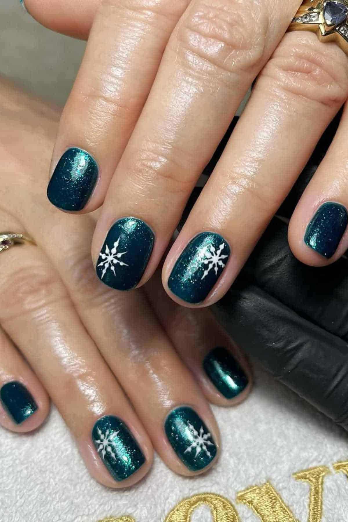Teal Glitter Snowflake Nails