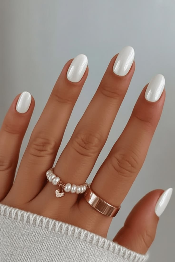 Almond shaped milky white nails with glazed donut chrome for holiday dinners.