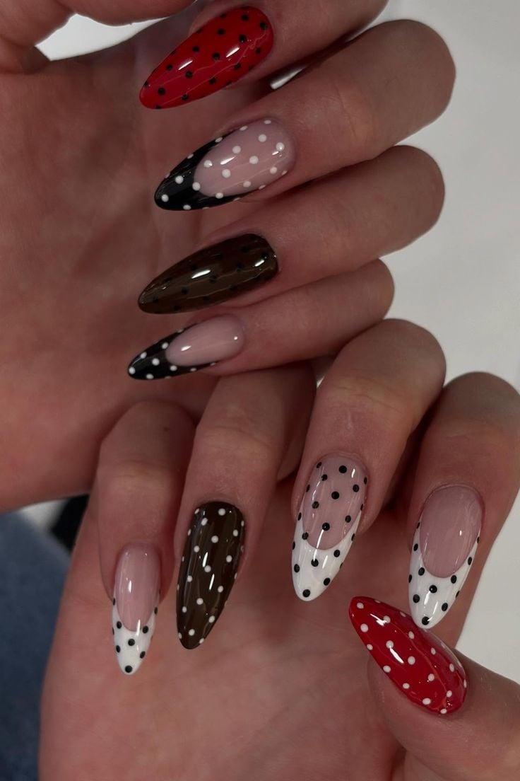 Minimalist white dot almond french nails on sheer pink glossy gel polish.