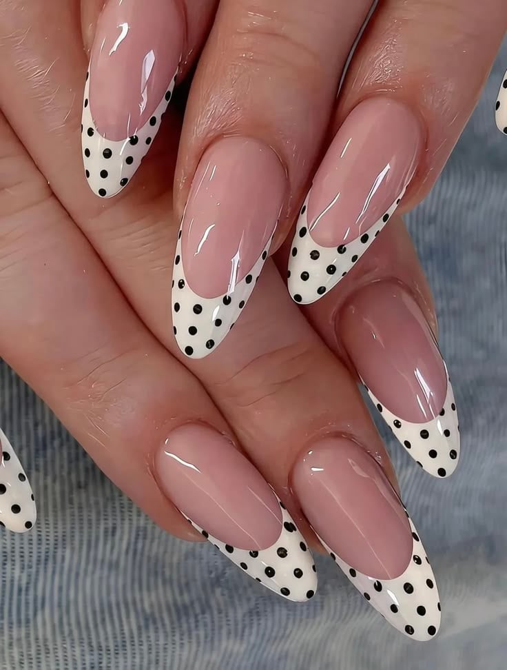 Modern white dot french tip nails on short round glossy finish for effortless chic style.