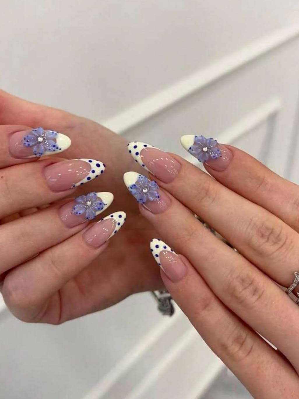 Sheer white dot french tip nails on coffin shape glossy polish for bridal nails.