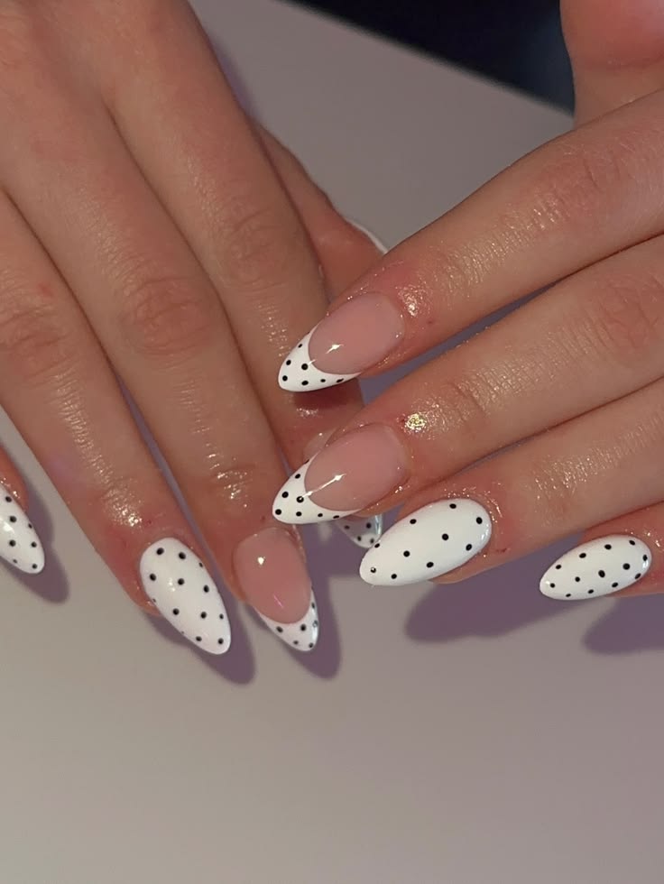 Minimalist white polka dot french nails on short oval glossy finish for everyday chic.